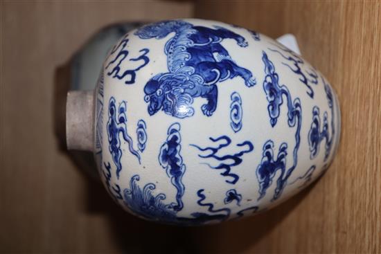 A Chinese blue and white lion-dog jar, Kangxi mark but late 19th century and a 19th century blue and white jar tallest 17cm, lacking